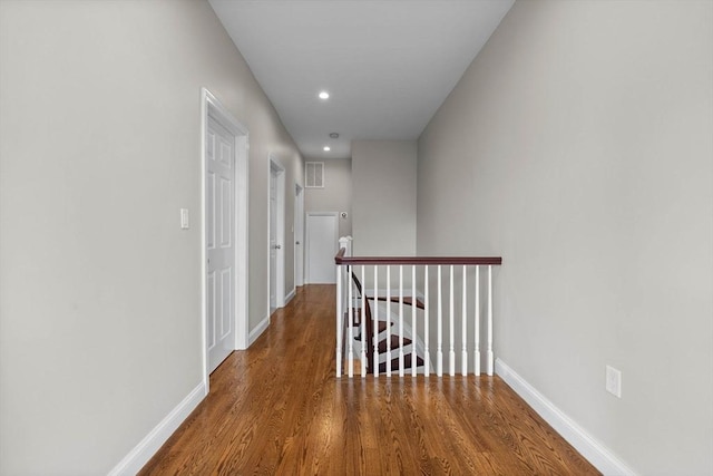 63 Perrin St, Boston, MA 02119 - corridor with an upstairs landing, wood finished floors, baseboards, and recessed lighting