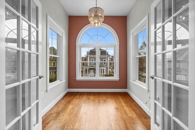 63 Perrin St, Boston, MA 02119 - unfurnished sunroom featuring a chandelier and french doors