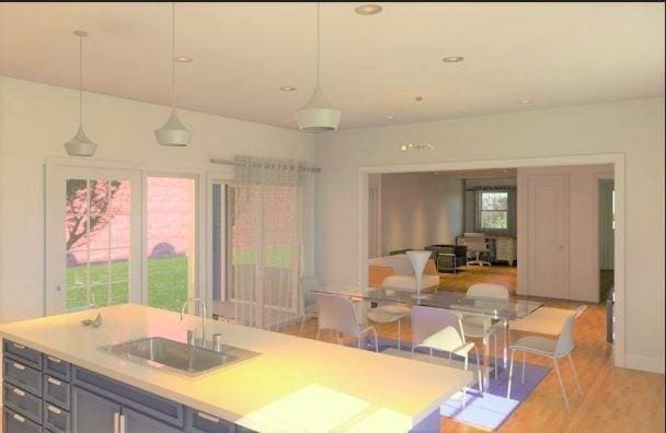 63 Perrin St, Boston, MA 02119 - kitchen featuring open floor plan, a sink, light countertops, pendant lighting, and recessed lighting