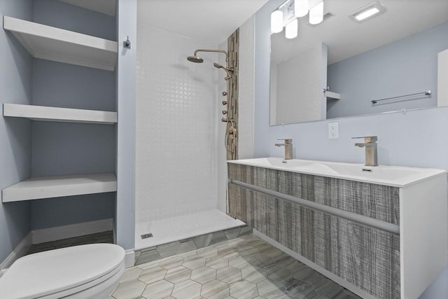 63 Perrin St, Boston, MA 02119 - full bathroom featuring toilet, a tile shower, double vanity, and tile patterned floors