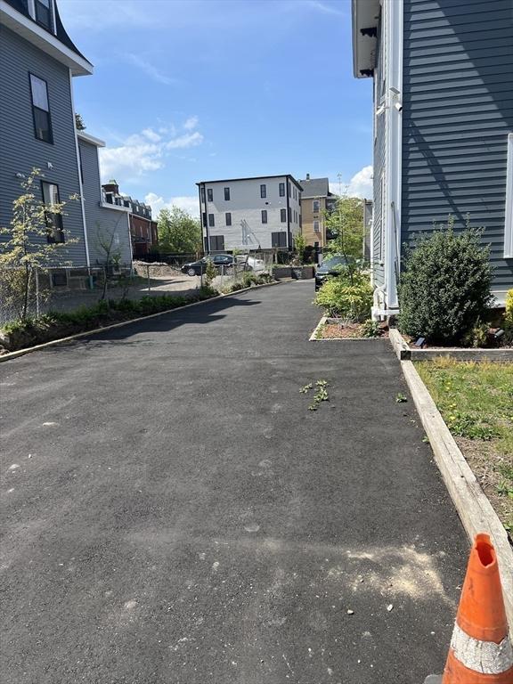 63 Perrin St, Boston, MA 02119 - view of asphalt road with a residential view and curbs