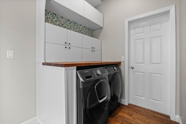 63 Perrin St, Boston, MA 02119 - laundry area with washing machine and dryer, cabinet space, and baseboards