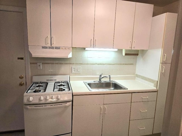6 Venice St Unit F2, Danvers, MA 01923 - kitchen featuring under cabinet range hood, gas range gas stove, a sink, light countertops, and tasteful backsplash
