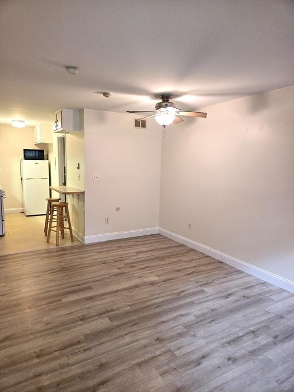 6 Venice St Unit F2, Danvers, MA 01923 - empty room featuring a ceiling fan, baseboards, and wood finished floors
