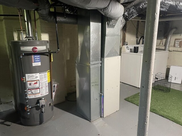 98 Everett St Unit 98, Easthampton, MA 01027 - utility room featuring water heater, washer / clothes dryer, and heating unit