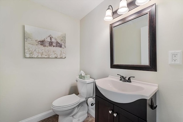 17 York Towne Ter Unit 17, Holden, MA 01520 - bathroom featuring baseboards, vanity, and toilet