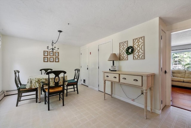 17 York Towne Ter Unit 17, Holden, MA 01520 - dining area featuring a textured ceiling and a chandelier