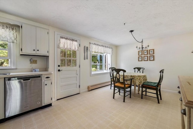 17 York Towne Ter Unit 17, Holden, MA 01520 - dining space featuring a baseboard radiator, baseboards, a textured ceiling, and a chandelier