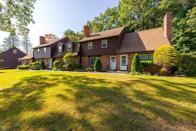 17 York Towne Ter Unit 17, Holden, MA 01520 - colonial inspired home with a front lawn, brick siding, and a chimney