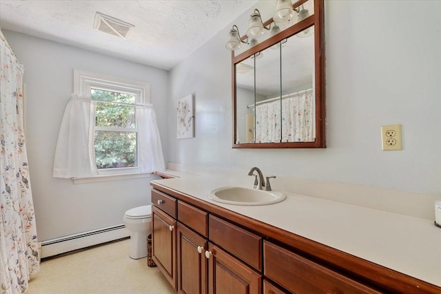 17 York Towne Ter Unit 17, Holden, MA 01520 - full bathroom featuring a baseboard radiator, vanity, toilet, and a shower with curtain