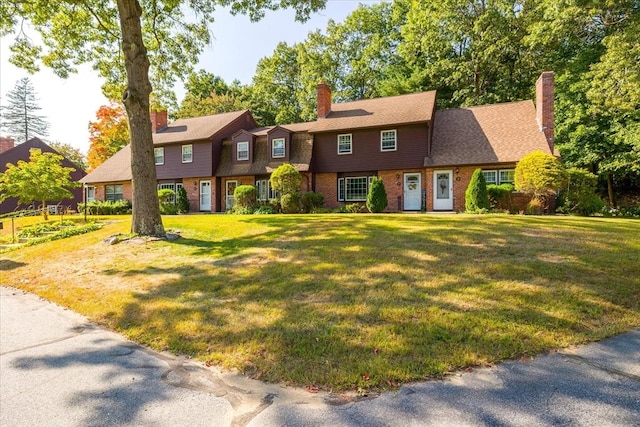 17 York Towne Ter Unit 17, Holden, MA 01520 - view of front of property with a front yard, a chimney, and brick siding