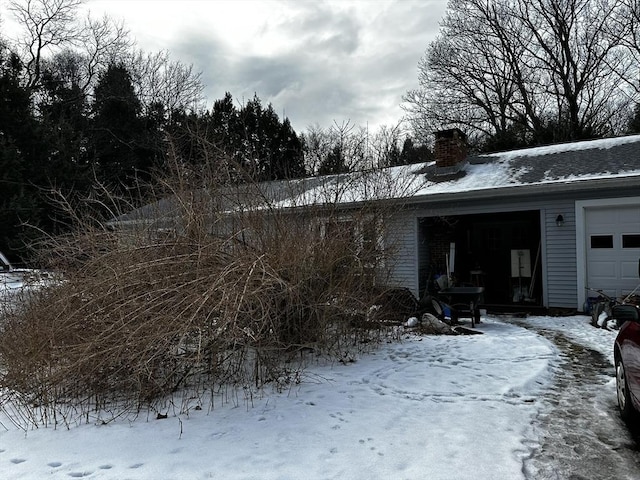 view of snow covered garage