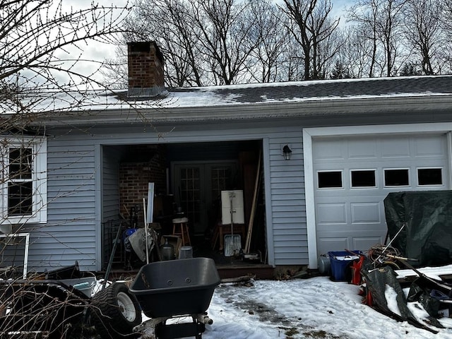 view of snow covered garage