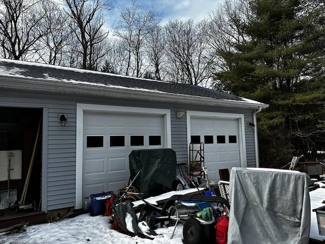 view of snow covered garage