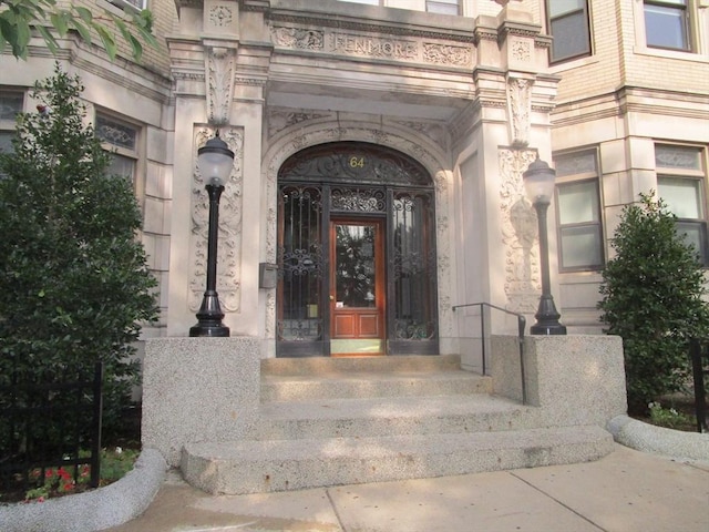 property entrance with stone siding