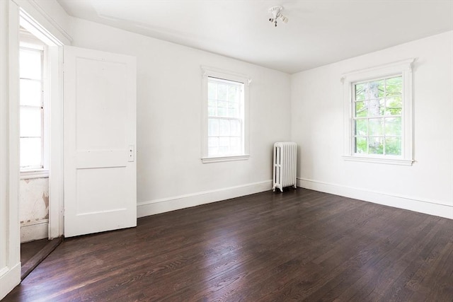 10 Ravenna Rd, Boston, MA 02132 - unfurnished room featuring radiator heating unit, healthy amount of natural light, and dark wood-style flooring