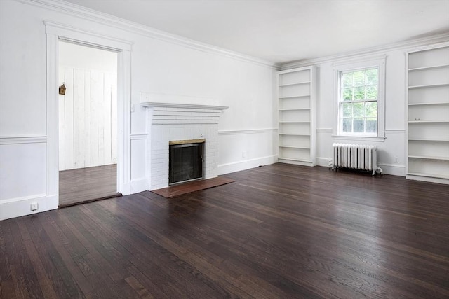 10 Ravenna Rd, Boston, MA 02132 - unfurnished living room featuring radiator, built in shelves, a fireplace, wood finished floors, and crown molding