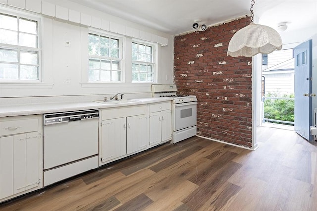 10 Ravenna Rd, Boston, MA 02132 - kitchen featuring white appliances, brick wall, dark wood-type flooring, light countertops, and white cabinetry