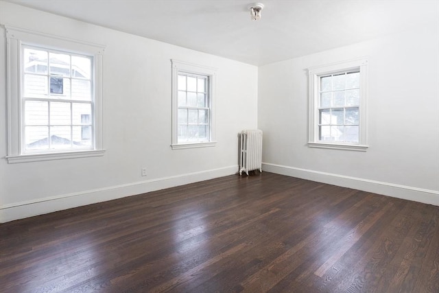 10 Ravenna Rd, Boston, MA 02132 - spare room with radiator, plenty of natural light, and dark wood finished floors