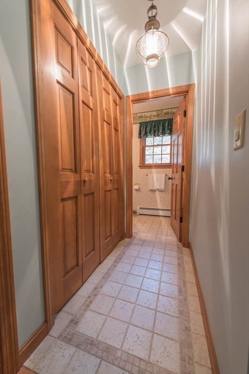 hallway with a baseboard heating unit