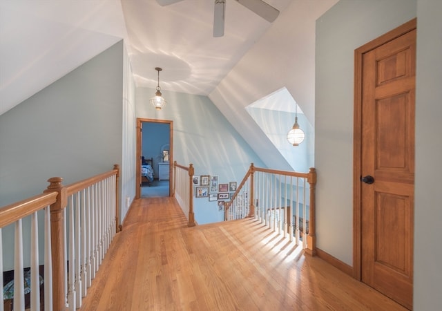 additional living space featuring light hardwood / wood-style flooring, lofted ceiling, and ceiling fan