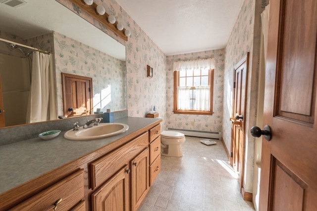 bathroom with baseboard heating, walk in shower, vanity, and toilet