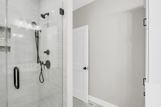 bathroom featuring an enclosed shower