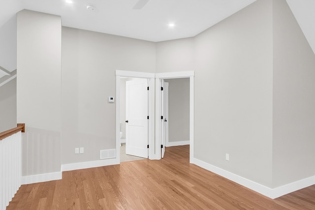 spare room with light hardwood / wood-style floors