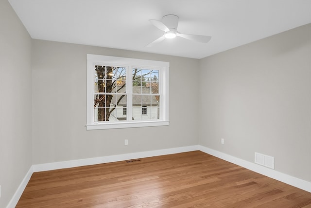 spare room featuring ceiling fan and light wood-type flooring