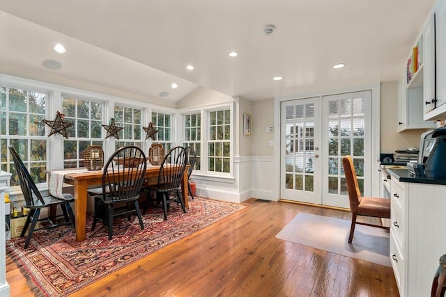 dining area with light wood-style flooring, french doors, wainscoting, and recessed lighting