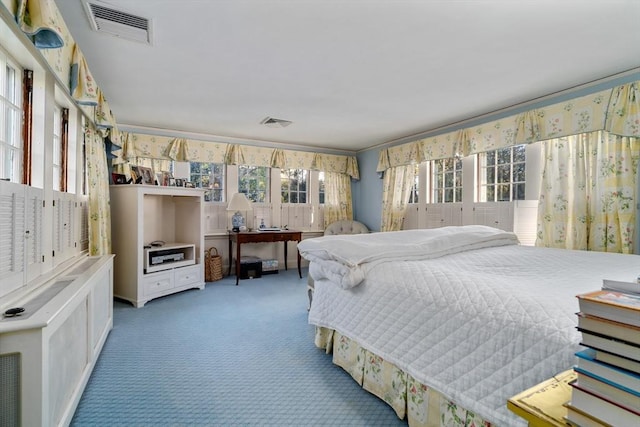 bedroom featuring visible vents and carpet flooring