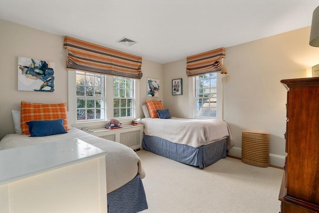 bedroom with visible vents, baseboards, and carpet floors