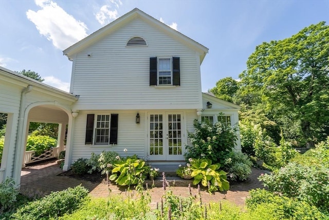 rear view of property featuring french doors