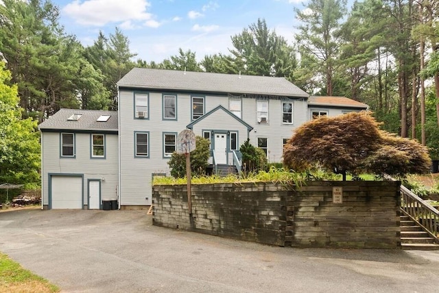 90 Southern Ave Unit 90, Essex, MA 01929 - view of front facade featuring a garage, view of scattered trees, and stairway