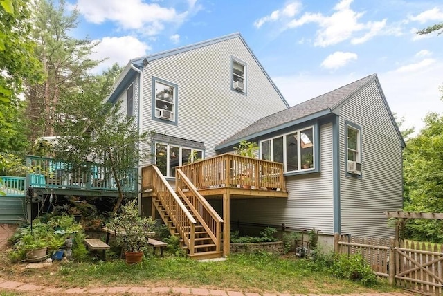 90 Southern Ave Unit 90, Essex, MA 01929 - back of property with stairway, a wooden deck, a shingled roof, and cooling unit