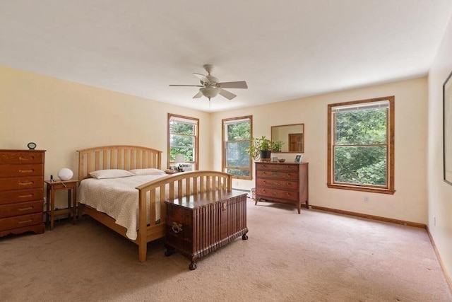 90 Southern Ave Unit 90, Essex, MA 01929 - bedroom featuring multiple windows, light colored carpet, ceiling fan, and baseboards
