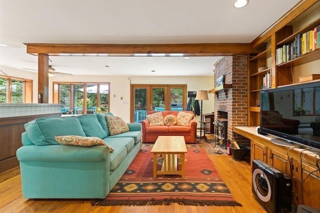 90 Southern Ave Unit 90, Essex, MA 01929 - living area featuring light wood finished floors, a brick fireplace, recessed lighting, ceiling fan, and french doors