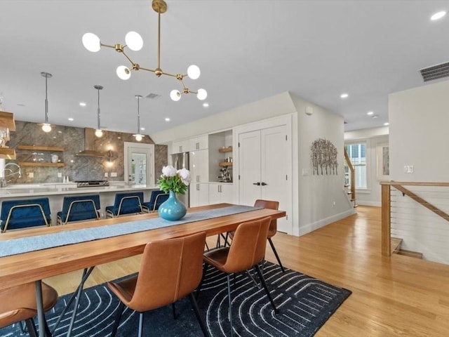 39 Paul St, Watertown, MA 02472 - dining area with light wood-style flooring, recessed lighting, and baseboards