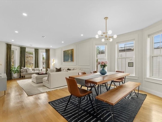 39 Paul St, Watertown, MA 02472 - dining space featuring a chandelier, light wood-type flooring, and recessed lighting