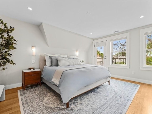 39 Paul St, Watertown, MA 02472 - bedroom with access to exterior, baseboards, light wood-style flooring, and recessed lighting