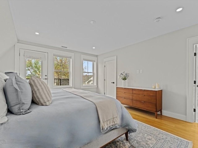 39 Paul St, Watertown, MA 02472 - bedroom with multiple windows, light wood-style flooring, baseboards, and recessed lighting
