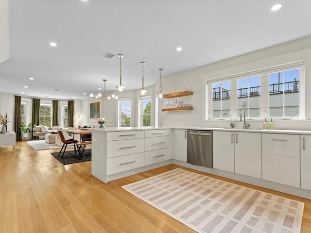 39 Paul St, Watertown, MA 02472 - kitchen with dishwasher, a sink, open floor plan, recessed lighting, and a peninsula