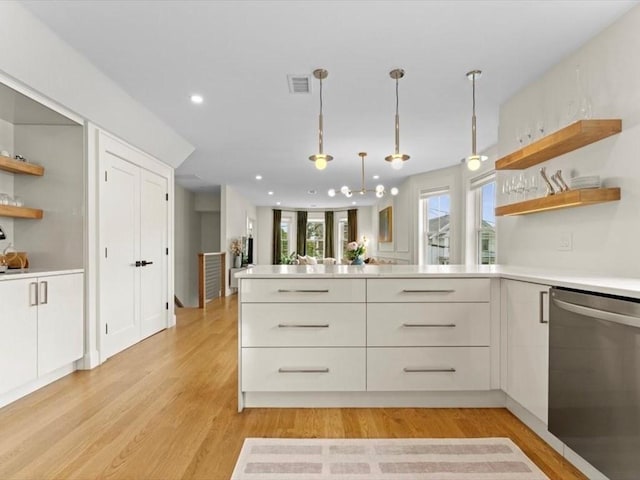 39 Paul St, Watertown, MA 02472 - kitchen featuring open shelves, stainless steel dishwasher, light countertops, a peninsula, and recessed lighting
