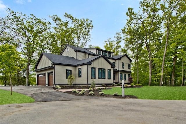LOT3 Ridge Rd, Northborough, MA 01532 - view of front of property with asphalt driveway, a garage, a front yard, and board and batten siding