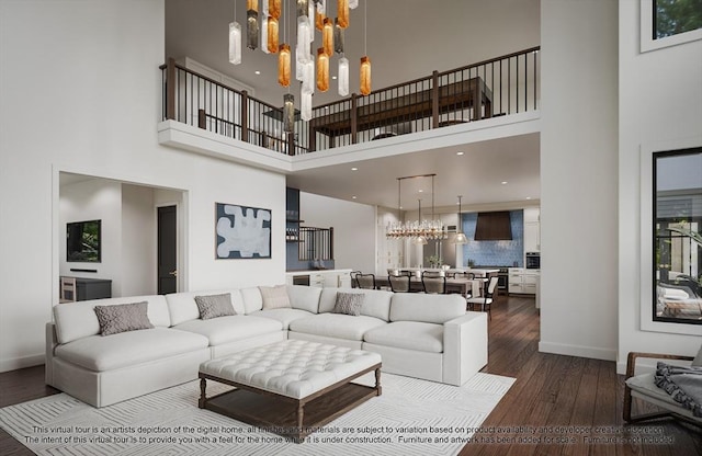 LOT3 Ridge Rd, Northborough, MA 01532 - living area with a chandelier, a towering ceiling, dark wood-style floors, and baseboards