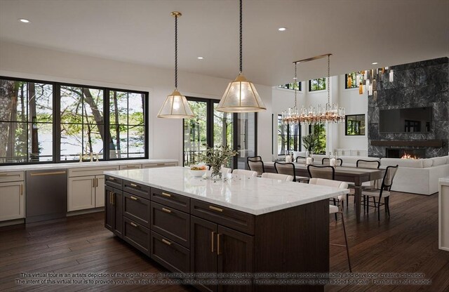 LOT3 Ridge Rd, Northborough, MA 01532 - kitchen with stainless steel dishwasher, dark wood-style flooring, light stone counters, a breakfast bar, and decorative light fixtures