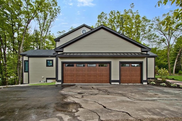 LOT3 Ridge Rd, Northborough, MA 01532 - view of front facade with asphalt driveway, a garage, metal roof, and a standing seam roof