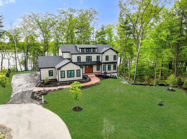 LOT3 Ridge Rd, Northborough, MA 01532 - modern inspired farmhouse featuring board and batten siding, concrete driveway, a front yard, and view of wooded area