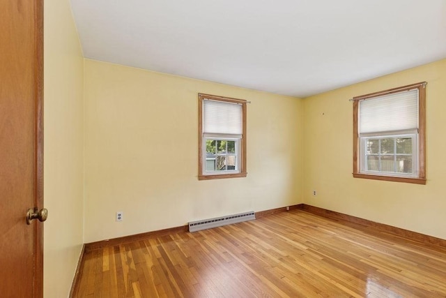 32 Cambo St, Brockton, MA 02301 - unfurnished room with baseboard heating, plenty of natural light, and light wood finished floors