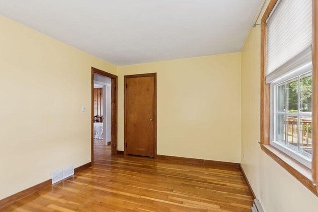 32 Cambo St, Brockton, MA 02301 - empty room featuring light wood finished floors and baseboard heating
